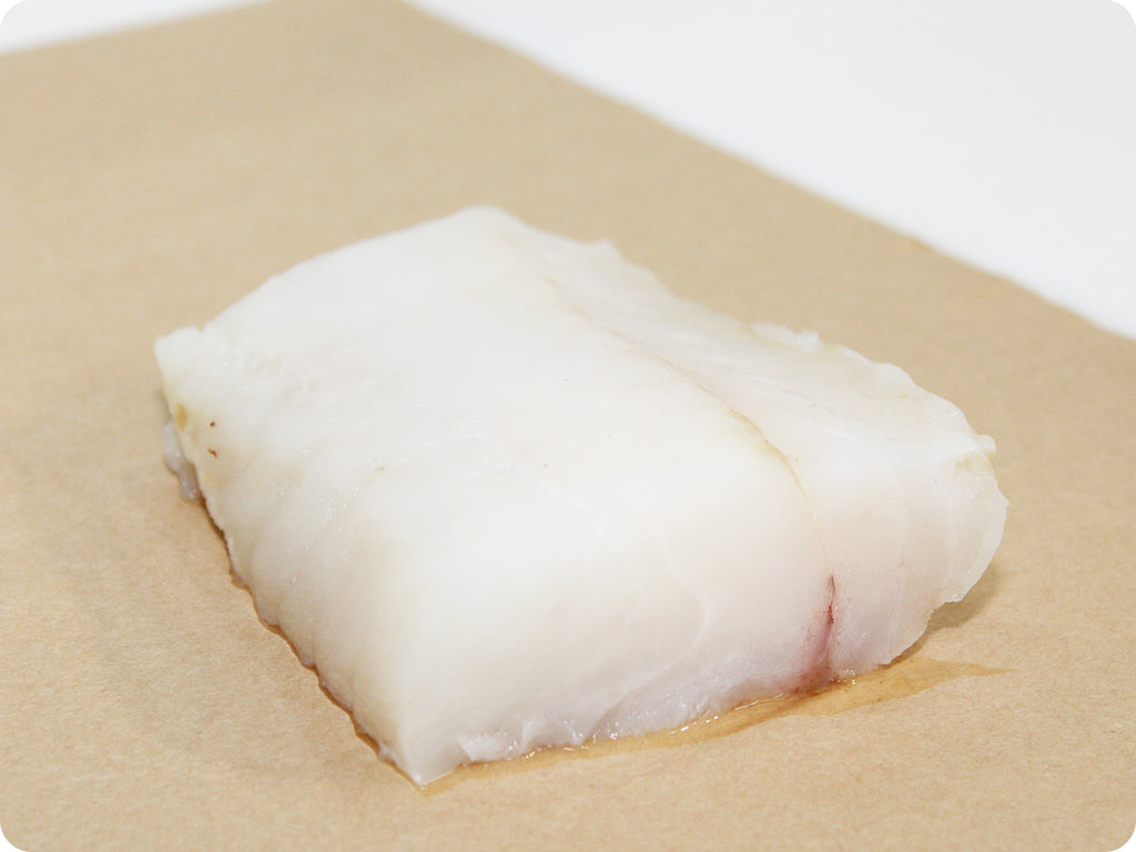 pacific cod fillet on cutting board