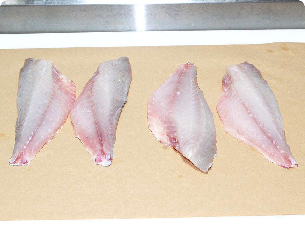 fresh red snapper on cutting board