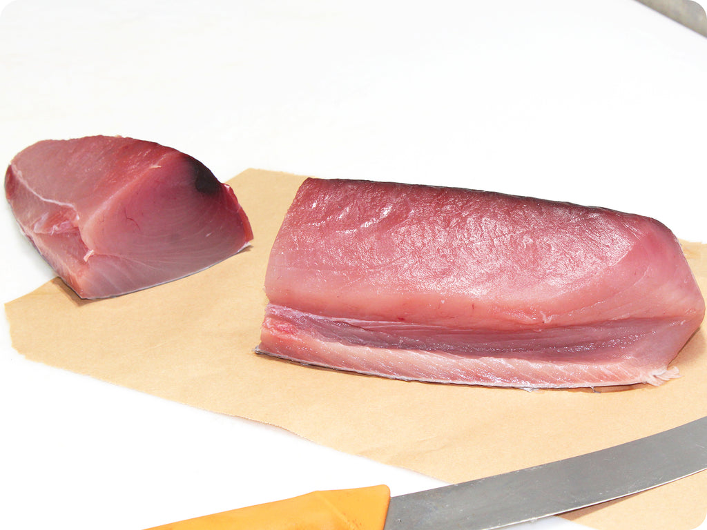 fresh tombo tuna loin and yellow scimitar knife
