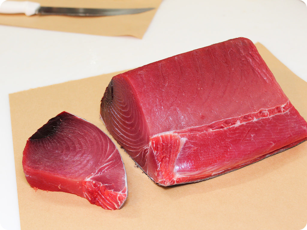 fresh ahi tuna loin and a tuna steak close-up 