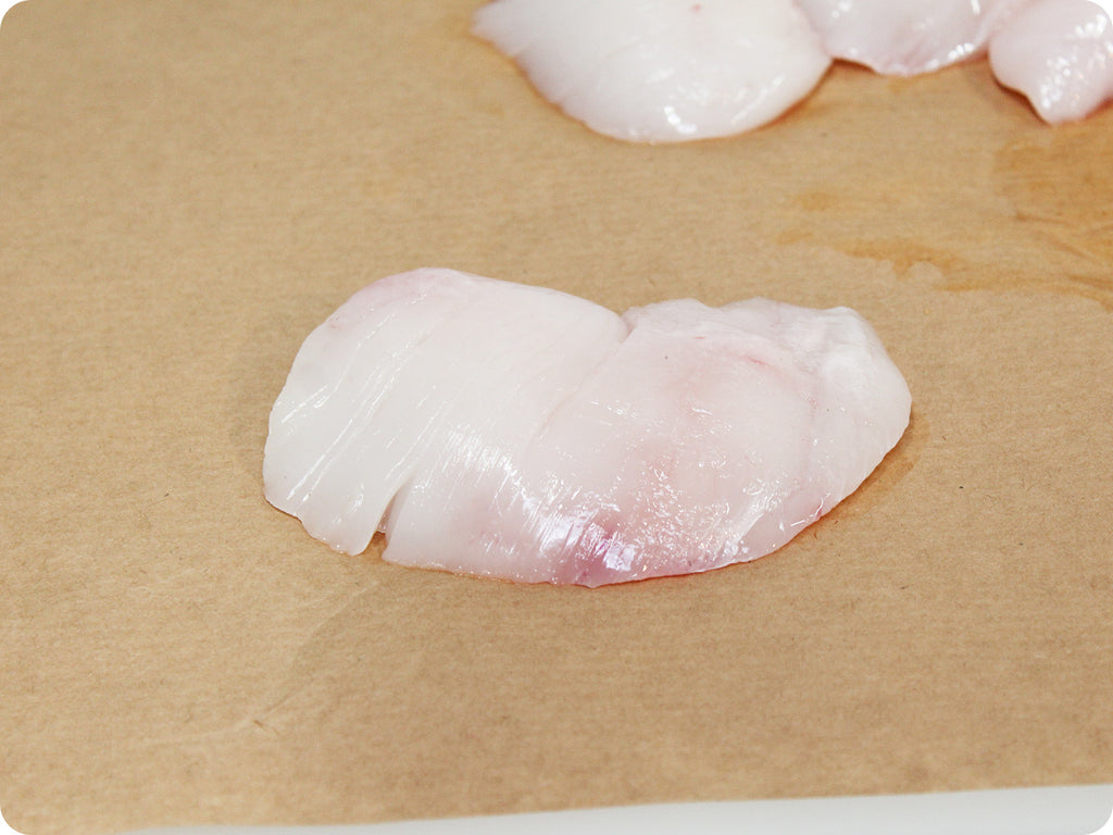 fresh halibut cheeks on cutting board