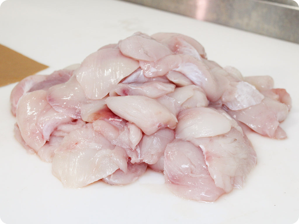 fresh halibut cheeks on cutting board