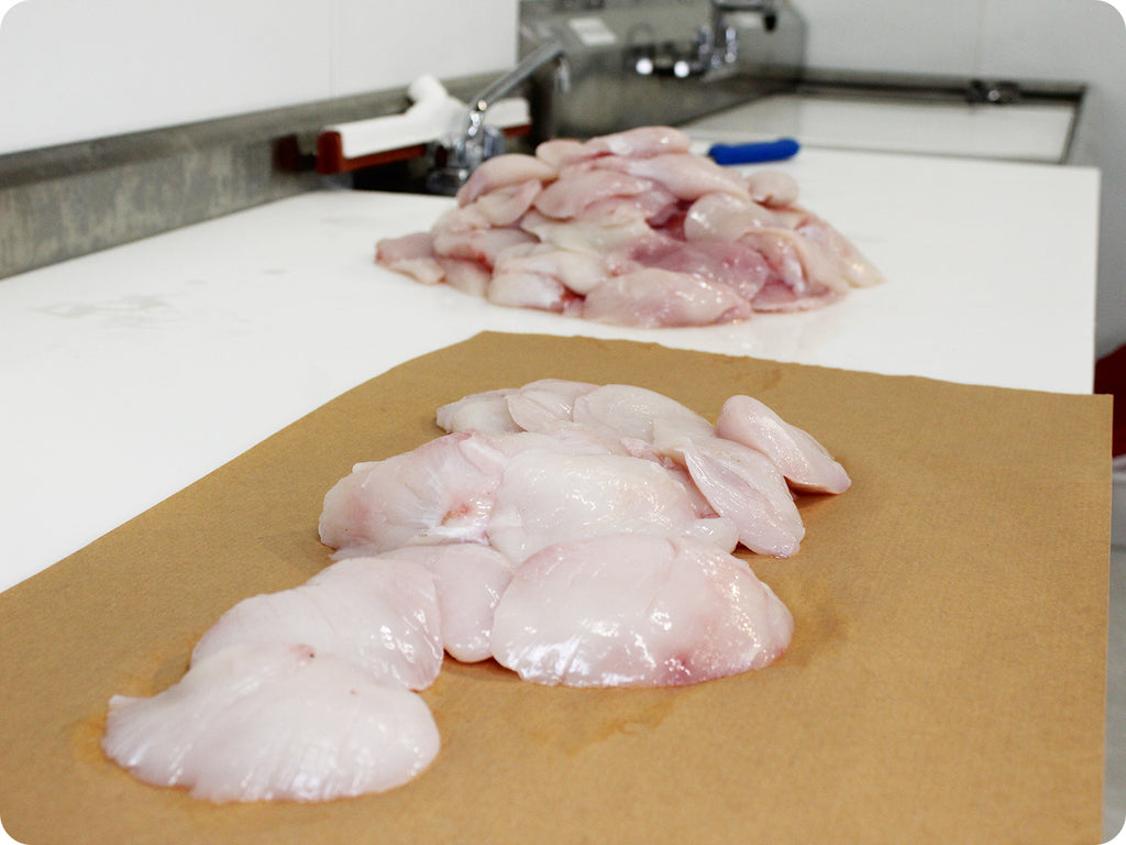 fresh halibut cheeks on cutting board