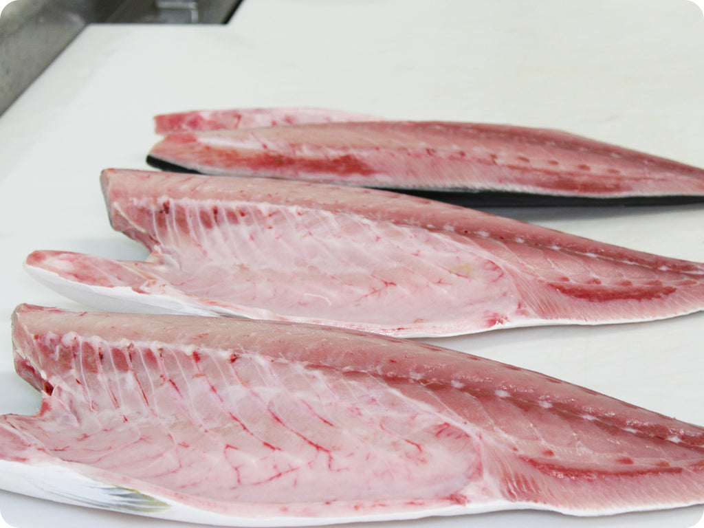 hamachi fillet on cutting board