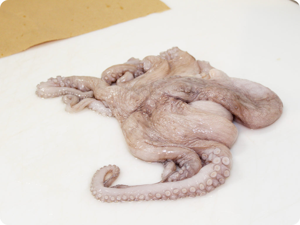 mediteranean octopus on cutting board
